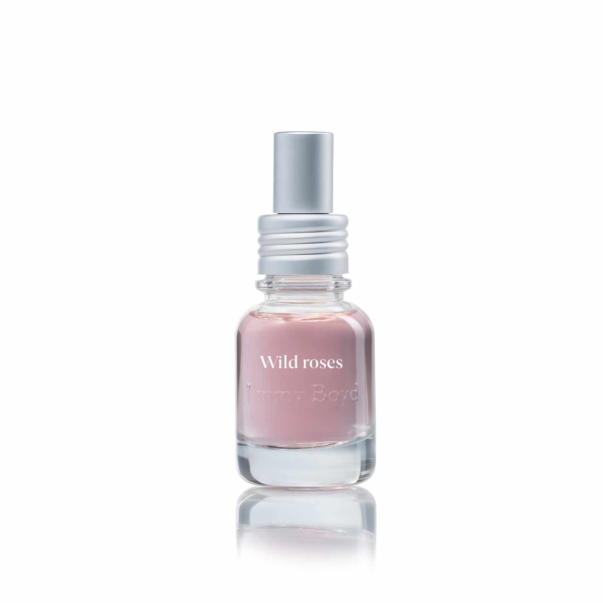 Botella de fragancia bio orgánica Wild Roses con pétalos de rosas silvestres