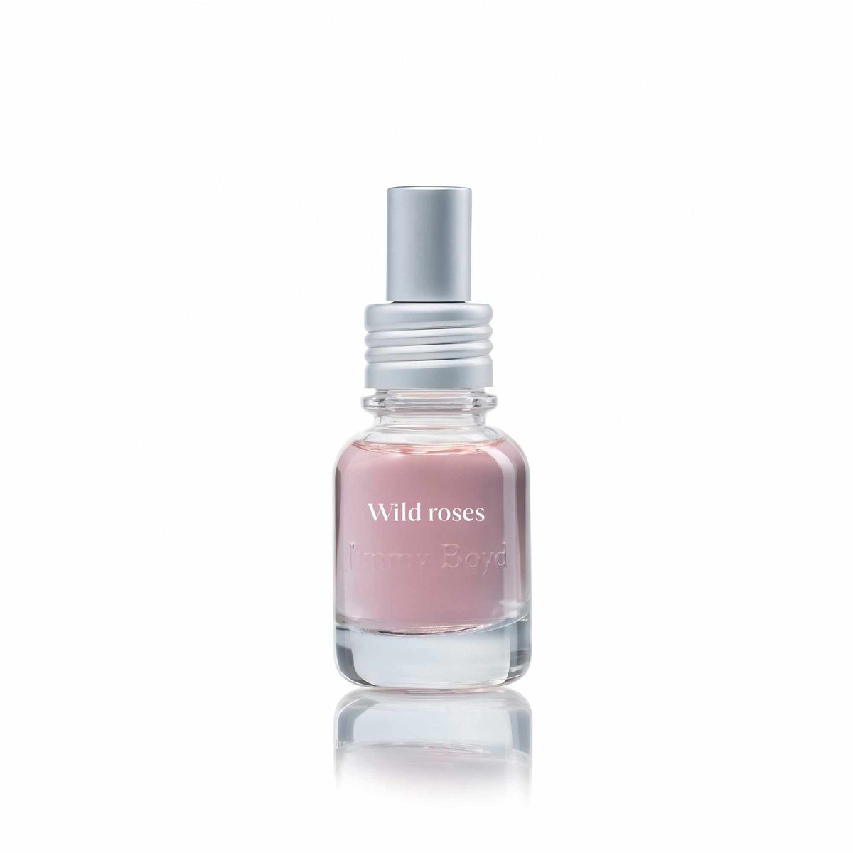 Botella de fragancia bio orgánica Wild Roses con pétalos de rosas silvestres